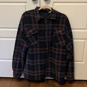 Plaid pullover with front pockets and drawstring bottom